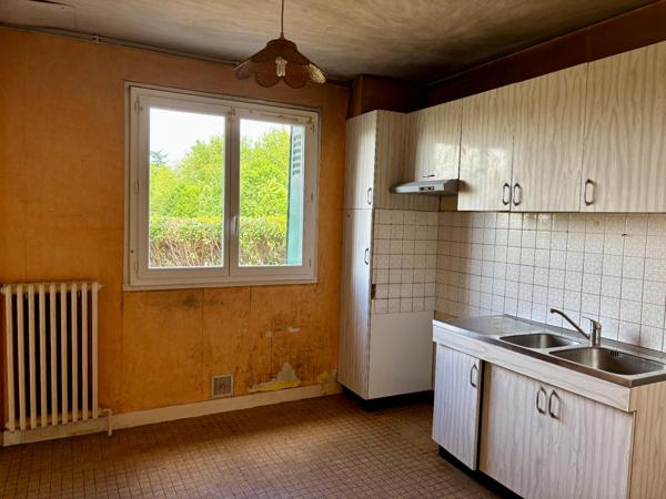 Maison avec garage et jardin