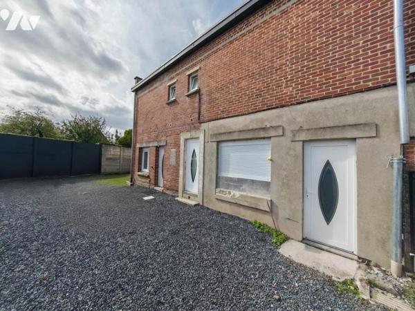 SAINT SAULVE IMMEUBLE COMPRENANT MAISON AVEC TERRAIN DEPENDANCES ET GARAGE 