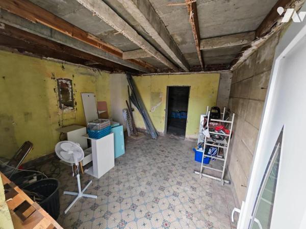 SAINT SAULVE IMMEUBLE COMPRENANT MAISON AVEC TERRAIN DEPENDANCES ET GARAGE 