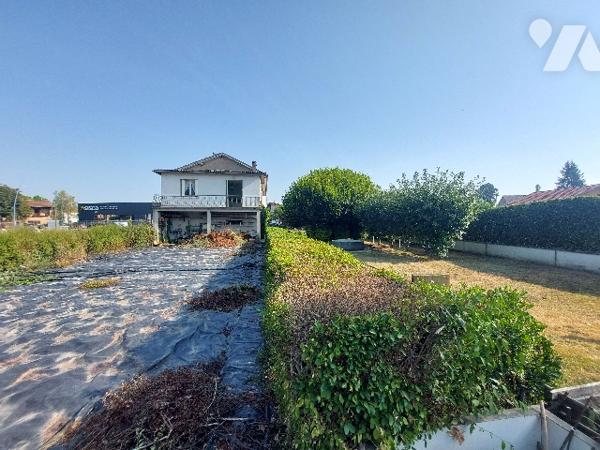 SAINT GAUDENS, ensemble immobilier constitué de trois logements sur un terrain de 1106 m².