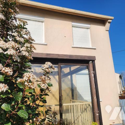 Maison familiale avec garage, jardin clos et véranda