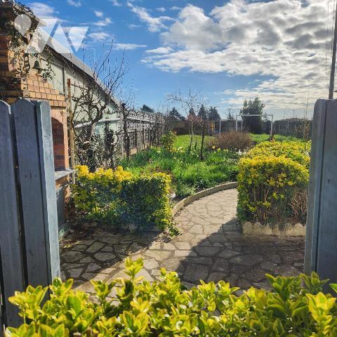 Maison familiale avec garage, jardin clos et véranda