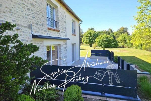 Maison en pierres de 9 pièces avec dépendances, garage et terrain