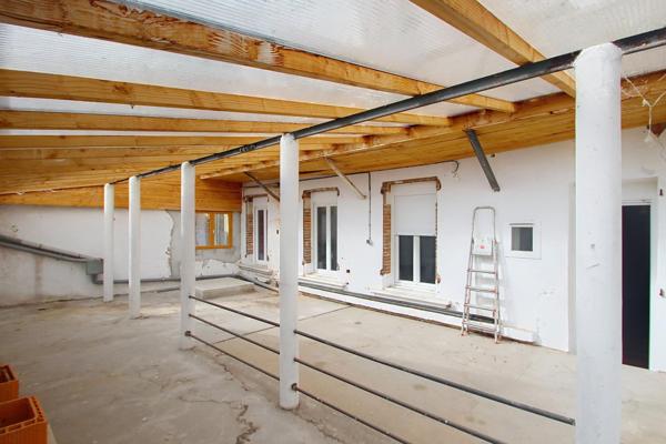 Appartement de 140 m² avec cour privative et dépendance en plein centre-ville