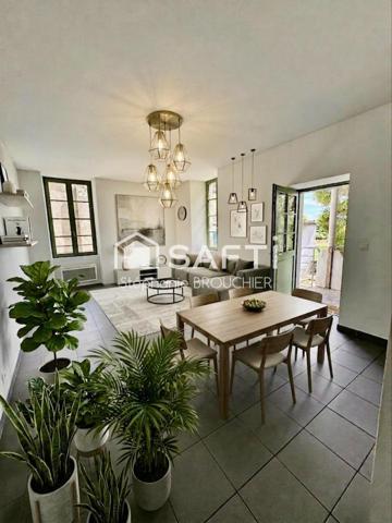 Appartement avec cave terrasse cour et local commercial