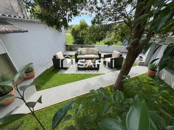 Appartement avec cave terrasse cour et local commercial