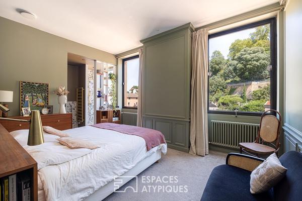 Appartement à l’élégance architecturale suspendue sur la Saône