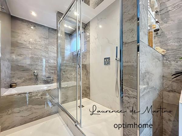 Appartement de 107 m2 rénovés avec suite parentale, terrasse, cave et parkings - Champs-Philippe -