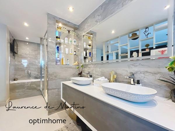 Appartement de 107 m2 rénovés avec suite parentale, terrasse, cave et parkings - Champs-Philippe -