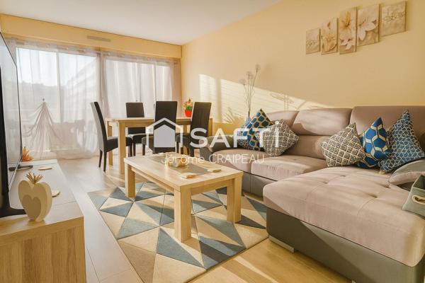 Appartement rénové avec 3 chambres, garage, cave et parking en centre-ville.