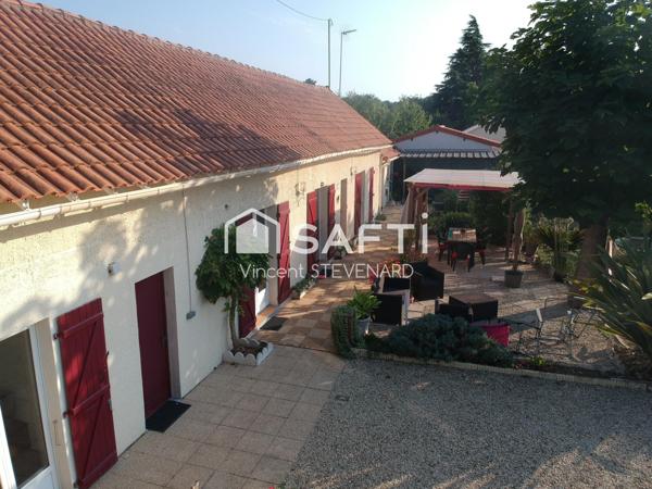 Maison T6 de 132m² avec jardin et garage.