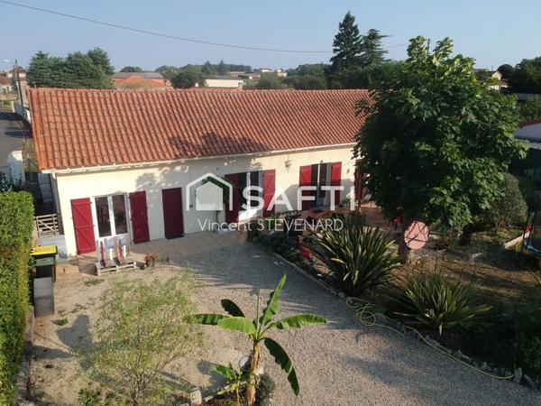 Maison T6 de 132m² avec jardin et garage.