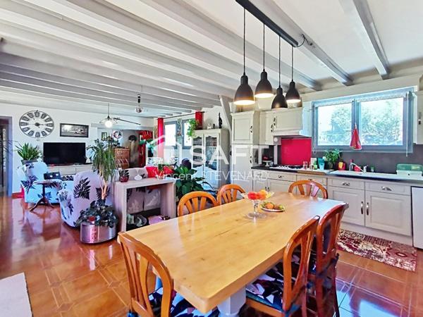 Maison T6 de 132m² avec jardin et garage.