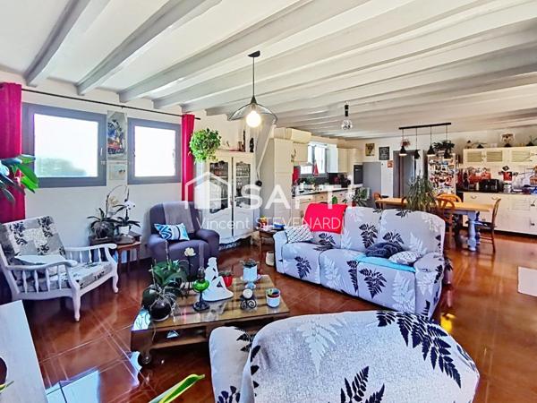 Maison T6 de 132m² avec jardin et garage.