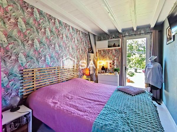 Maison T6 de 132m² avec jardin et garage.