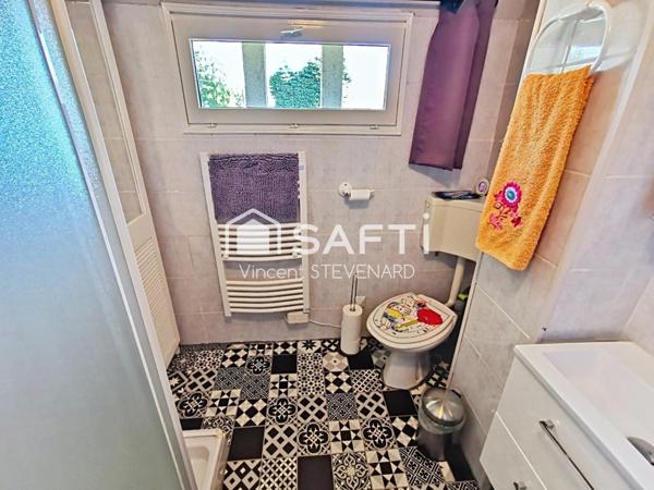 Maison T6 de 132m² avec jardin et garage.