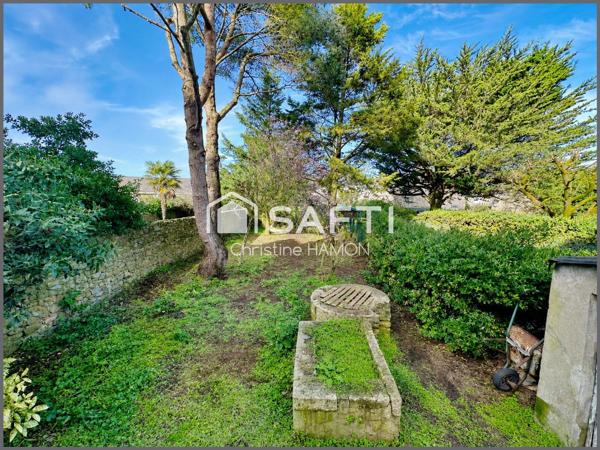 Maison à rénover en plein centre avec jardin