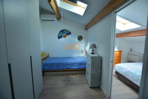Logement avec terrasse couverte