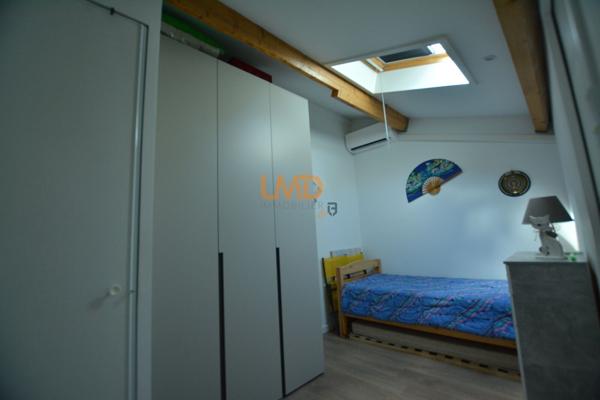 Logement avec terrasse couverte