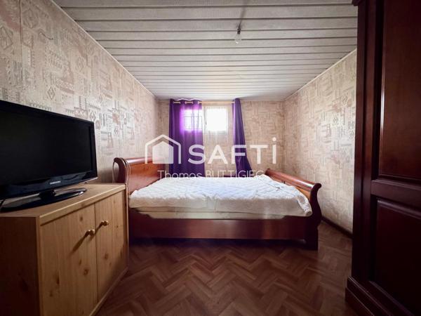 Maison 4 chambres, garage et jardin.