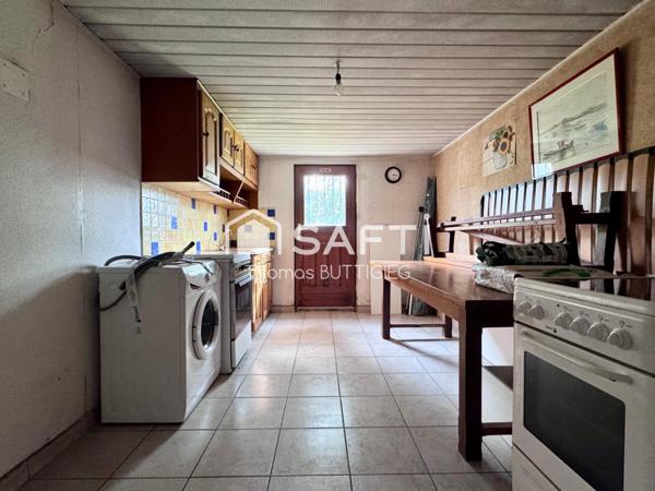 Maison 4 chambres, garage et jardin.