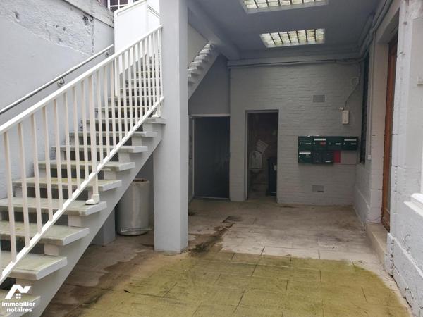 Immeuble composé de 7 appartements et un local commercial d'environ 412m².