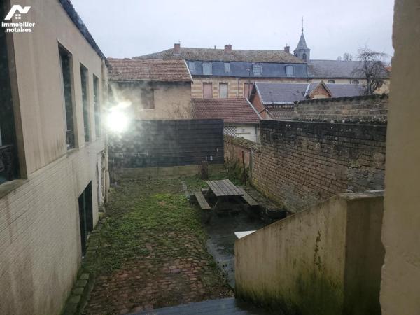 Immeuble composé de 7 appartements et un local commercial d'environ 412m².