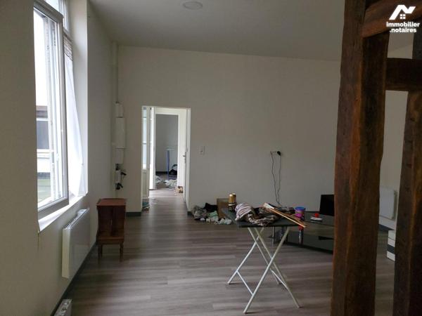 Immeuble composé de 7 appartements et un local commercial d'environ 412m².