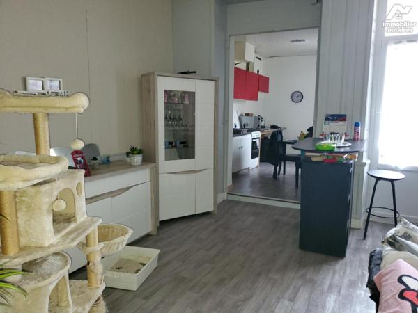 Immeuble composé de 7 appartements et un local commercial d'environ 412m².