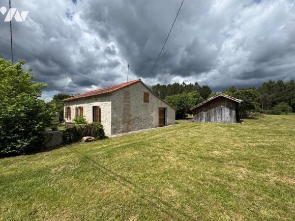 Charmante maison en pierre de plain-pied avec grand terrain constructible à Durance