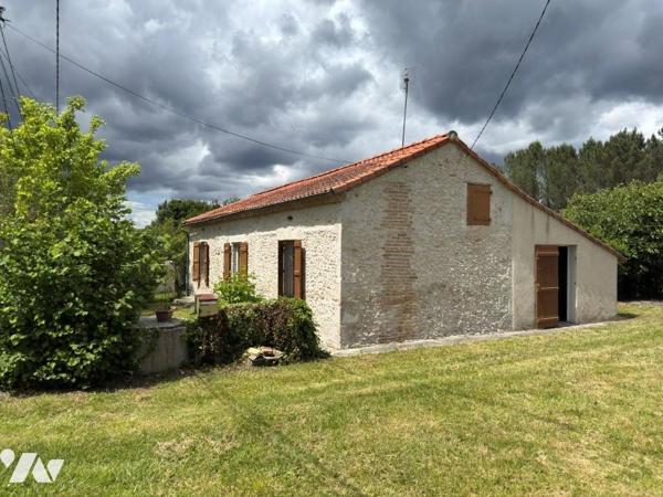 Charmante maison en pierre de plain-pied avec grand terrain constructible à Durance