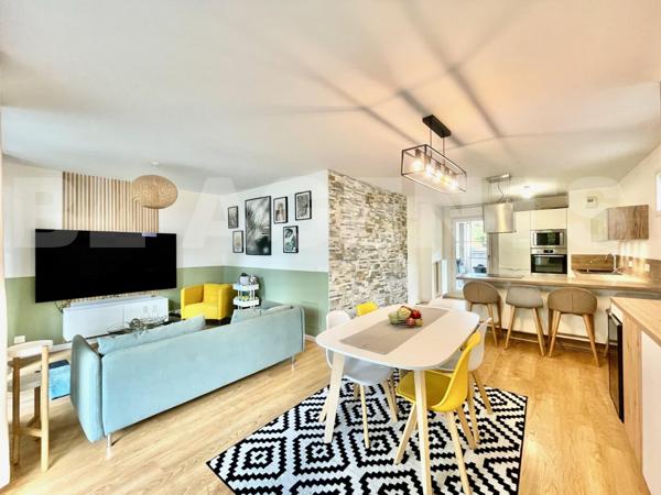 T3 de 78 m2 dans le centre ville avec jardin et parking.