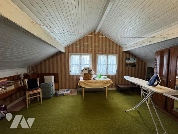 Maison proche centre ville dans environnement calme avec grand terrain