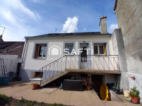 Maison rénovée sur sous-sol avec 3 chambres, garage et terrain