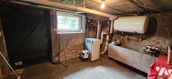 Maison de ville avec garage et terrain