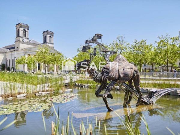 Appartement de type T4 avec balcon, cave et place de parking numérotée
