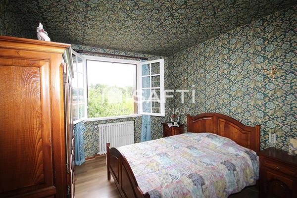 Maison sur sous-sol et grand garage - 3 chambres - Habitable à moderniser