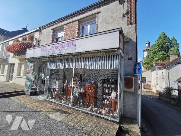 Une maison à usage de commerce et d’habitation