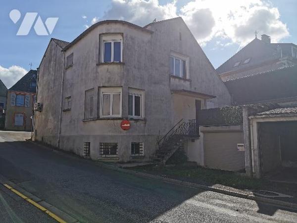 Une maison à usage de commerce et d’habitation