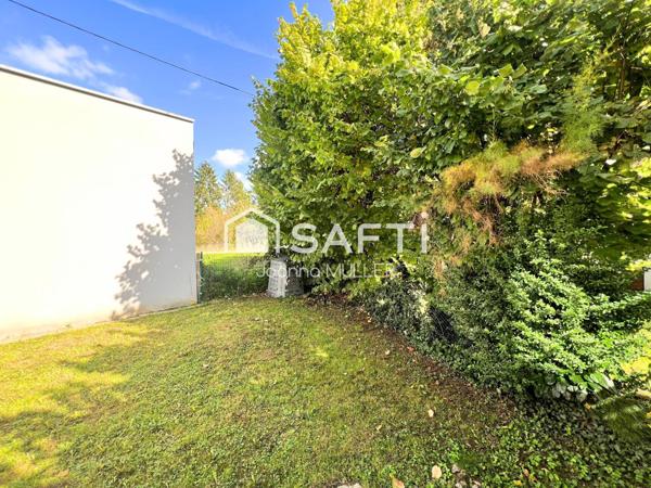 Maison mitoyenne de 125 m2 moderne avec jardin, garage et place de parking