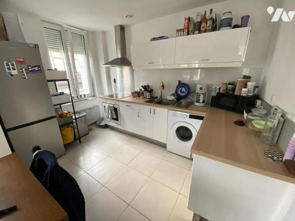 Denain, Immeuble de rapport à usage mixte.