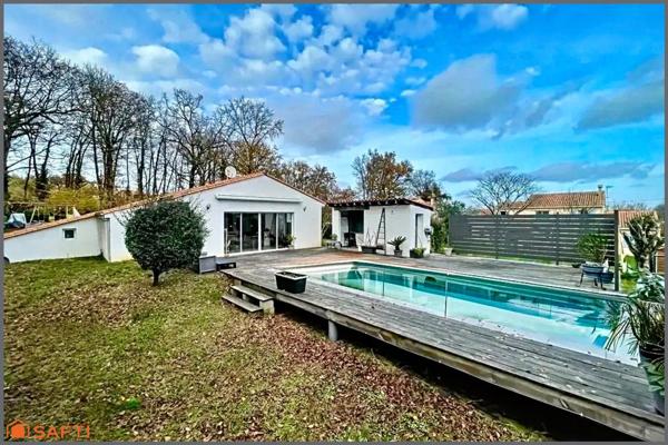 Pavillon plain-pied 5 chambres, 2 salles de bains, grande terrasse et piscine.