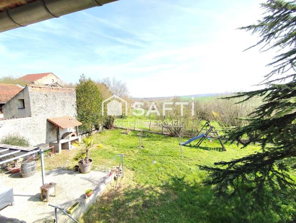 Charmante maison avec garage et jardin