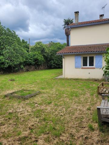 Maison de type T4 avec jardin et garage