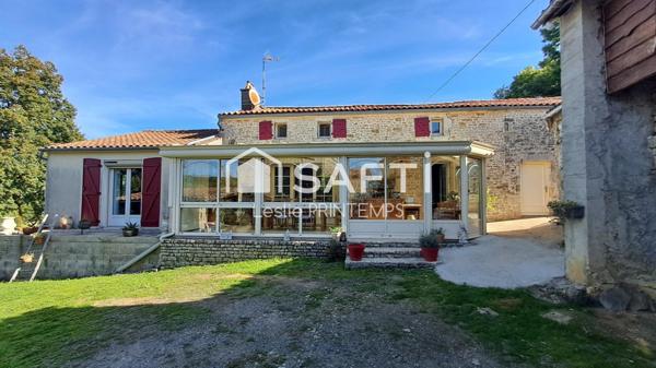 Maison spacieuse avec dépendances et jardin arboré