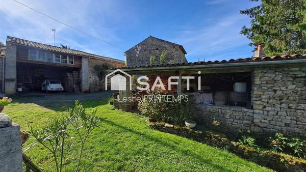 Maison spacieuse avec dépendances et jardin arboré