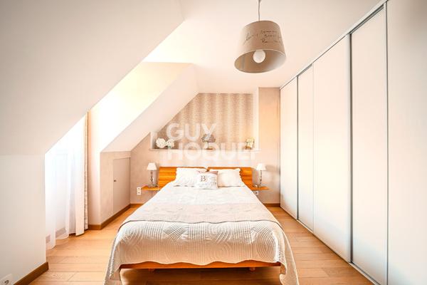 Maison familiale avec véranda de 28 m² et sous-sol total dans secteur recherché