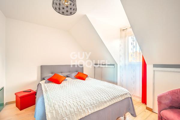 Maison familiale avec véranda de 28 m² et sous-sol total dans secteur recherché