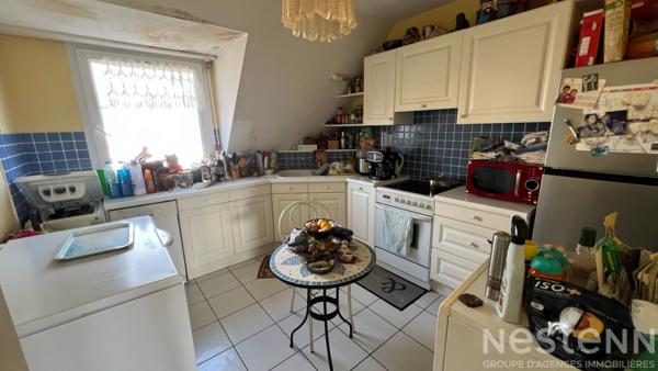 Confort et emplacement idéal : grand T4 avec terrasse ensoleillée, garage et cave à Auray