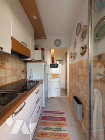  Adorable 2 pièces en rez-de-jardin avec grand extérieur au calme